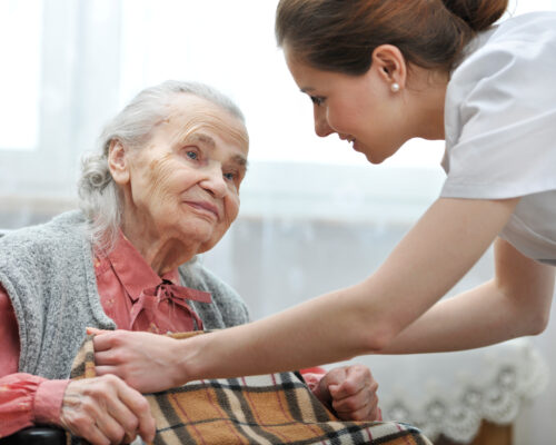 Female nurse is taking care of the senior woman